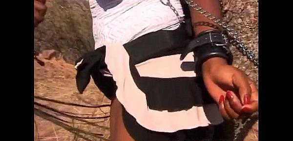  Torturing African slut outdoors tied up big tits